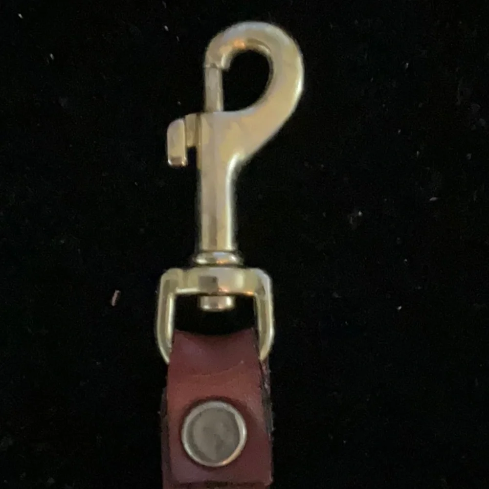 Cartier Elegant Red Leather Keychain with Gold Hardware